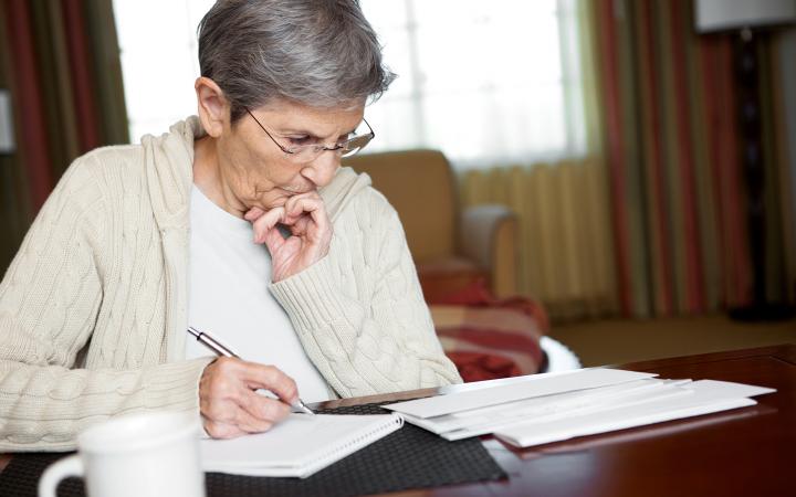 Women at table looking over documents